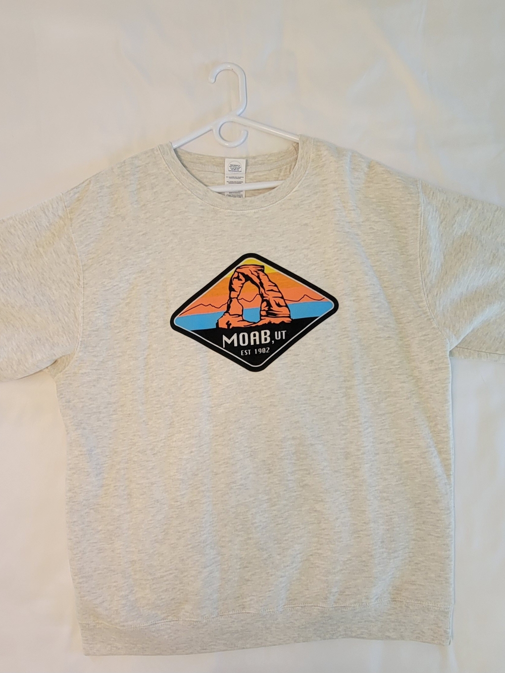 Light heather short sleeve tee with a Moab, UT graphic.